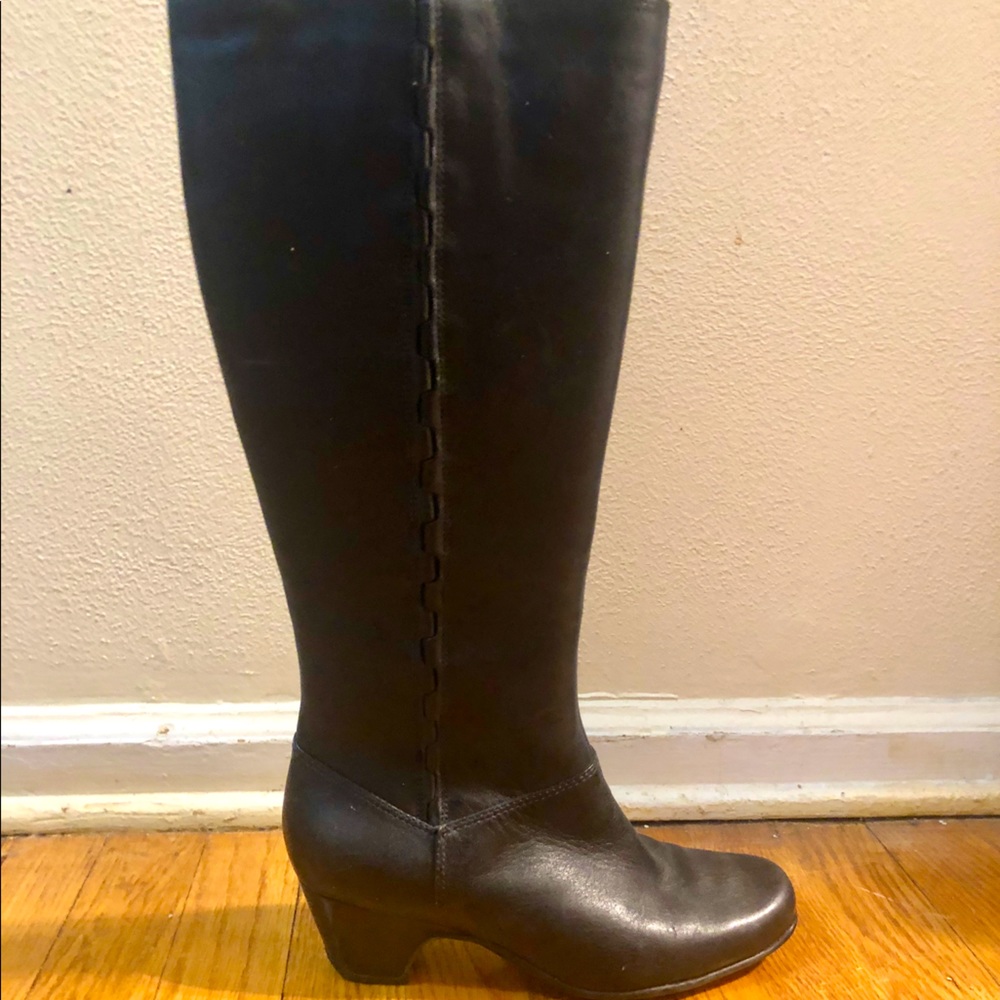 Black high boots with heels and stitching detail